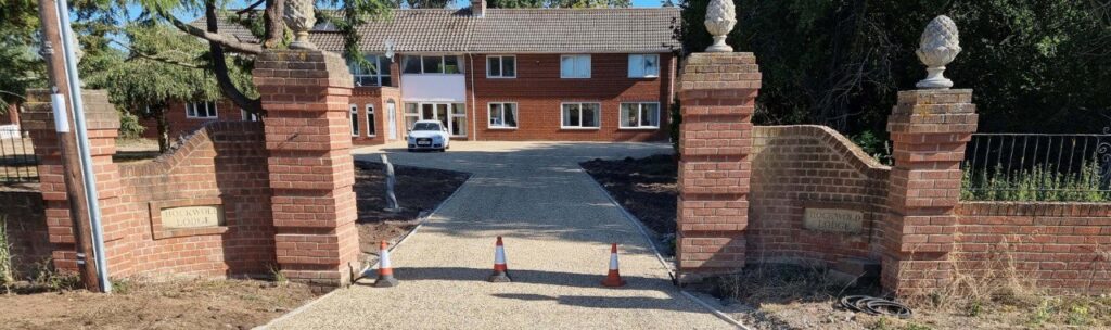 This is a photo of a newly installed chip and tar driveway, installed by Rye Driveways